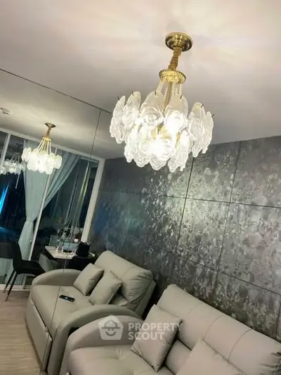 Luxurious living room with elegant chandelier and modern decor