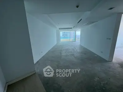 Spacious unfurnished apartment with large windows and city view