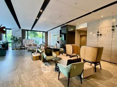 Luxurious modern living room with elegant furniture and large windows