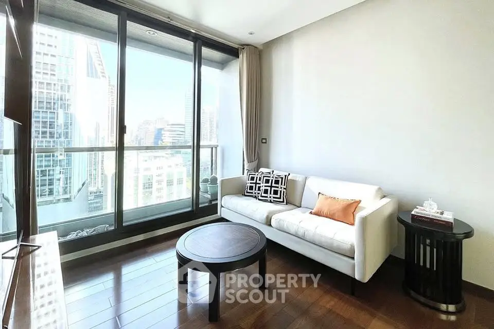 Modern living room with city view and stylish furniture in high-rise apartment