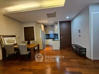 Modern apartment interior with wooden flooring and open kitchen layout