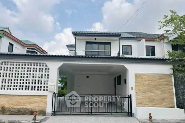 Charming two-story house with spacious driveway and modern facade