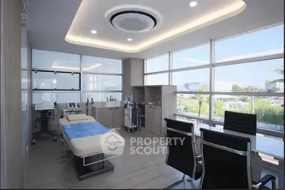 Modern medical office with sleek design and large windows offering natural light and scenic views.