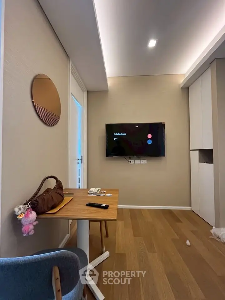 Modern living room with wall-mounted TV and stylish decor