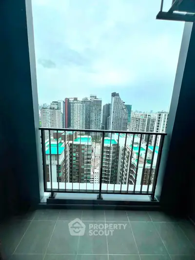 Stunning high-rise balcony view overlooking city skyline with modern skyscrapers.
