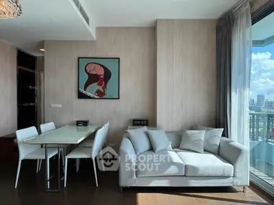 Modern living room with elegant dining area and city view balcony.