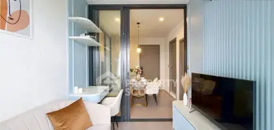 Modern living room with stylish decor and open dining area