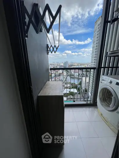High-rise balcony with laundry area and stunning city view