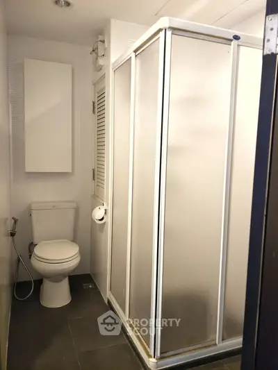 Compact bathroom with shower enclosure and modern fixtures