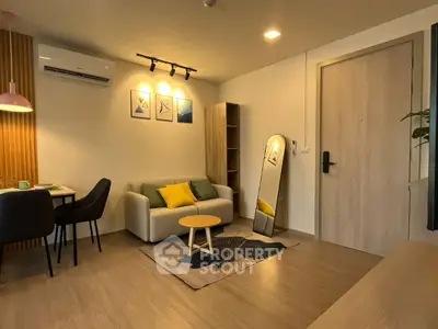 Modern living room with stylish decor and cozy seating area.