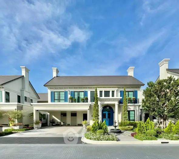 Stunning luxury home exterior with manicured garden and elegant architecture.