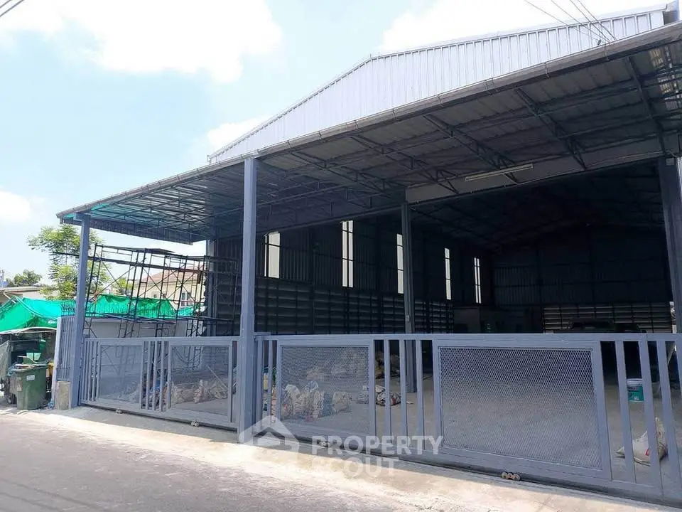 Spacious industrial warehouse with open layout and secure fencing in prime location.