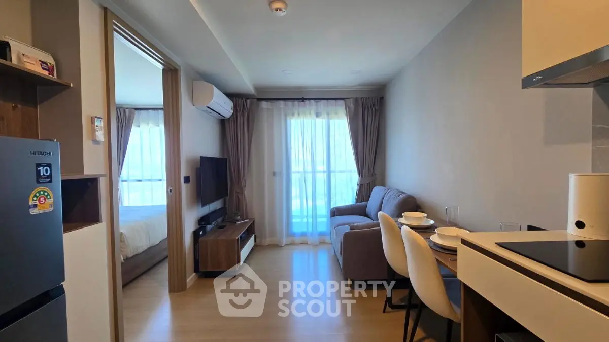 Modern apartment living room with open kitchen and cozy decor