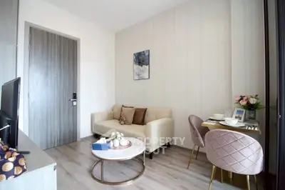 Modern living room with cozy sofa and dining area in stylish apartment.