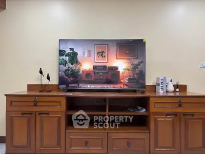Stylish living room with wooden entertainment unit and modern decor