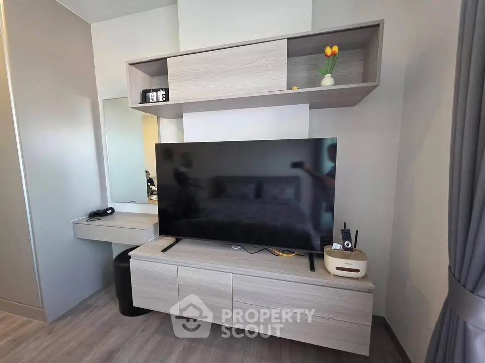 Modern living room with sleek TV unit and stylish shelving, perfect for contemporary living.