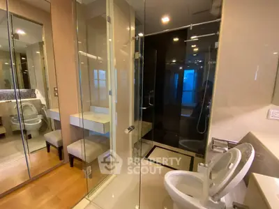 Luxurious modern bathroom with glass shower and elegant fixtures