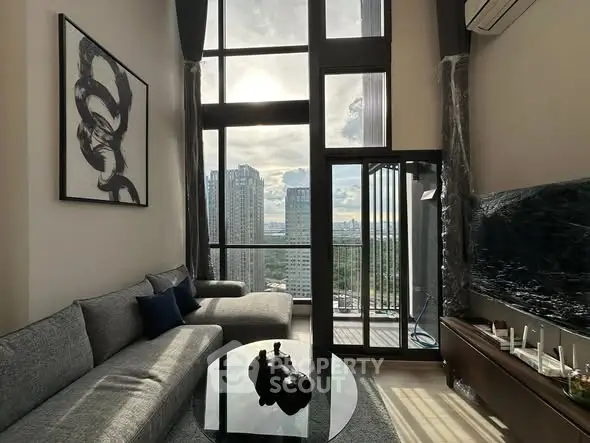 Luxurious high-rise living room with stunning city view and modern decor.