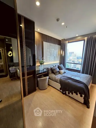 Luxurious bedroom with city view, modern decor, and elegant furnishings in a high-rise apartment.