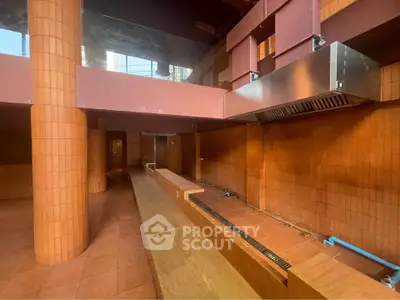 Unique architectural interior with terracotta tiles and modern design elements.