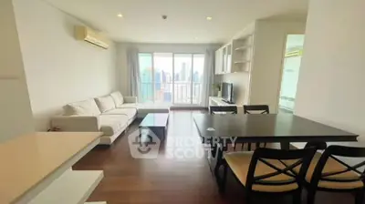 Spacious modern living room with city view and elegant furnishings