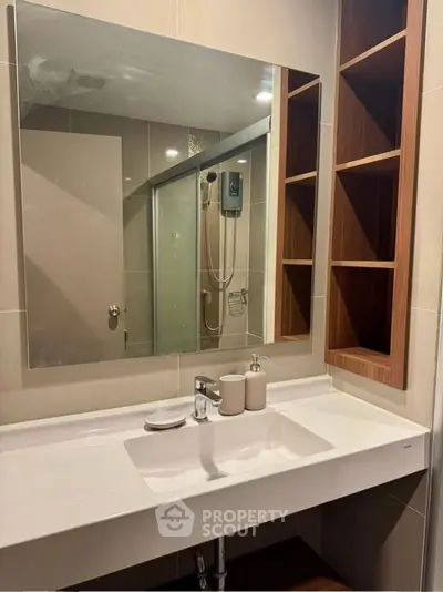 Modern bathroom with sleek sink and spacious shower area