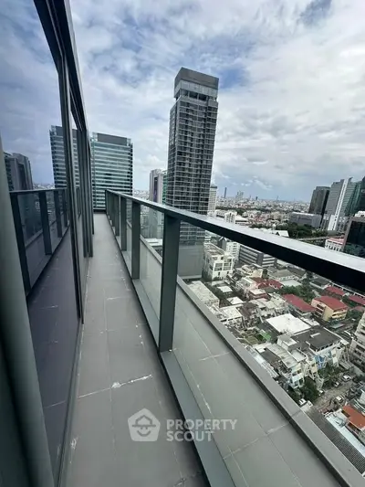 Stunning high-rise balcony with panoramic city views, perfect for urban living enthusiasts.