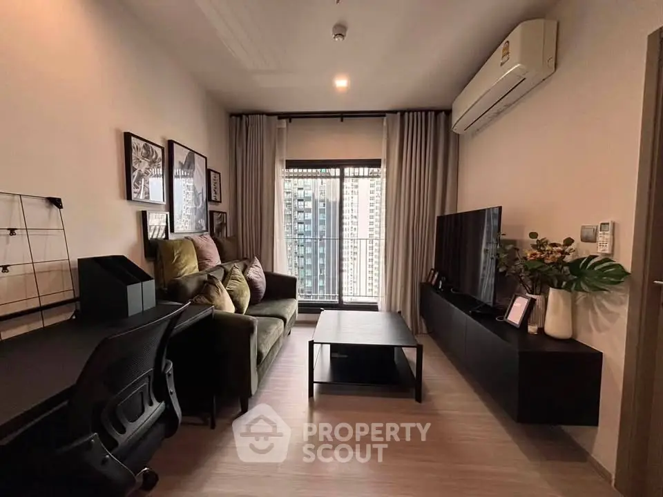 Modern living room with stylish decor and city view, featuring a cozy sofa and sleek entertainment unit.