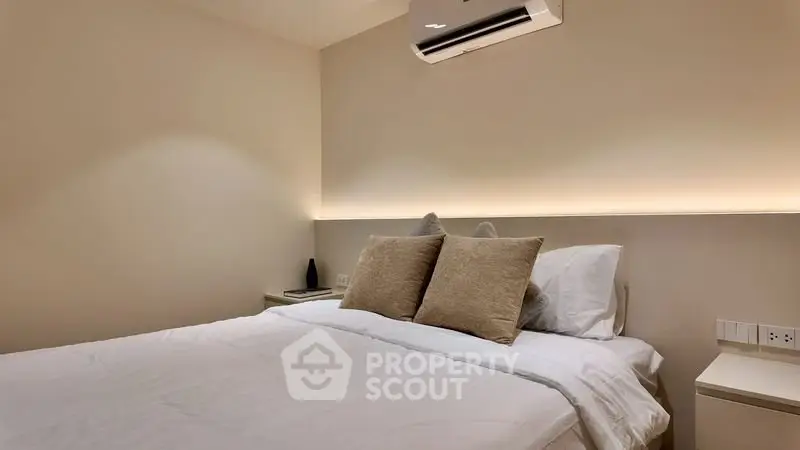 Cozy bedroom with modern air conditioning and ambient lighting