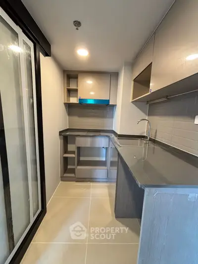 Modern kitchen with sleek countertops and ample storage space
