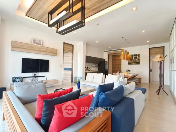 Spacious modern living room with stylish decor and ample natural light