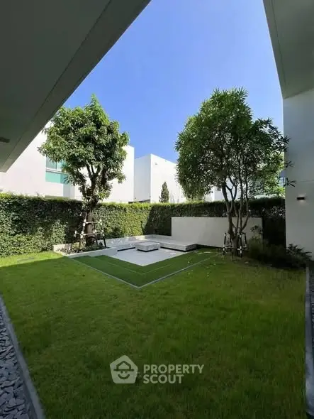 Luxurious garden view with lush greenery and modern landscaping