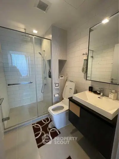 Modern bathroom with sleek shower and stylish vanity