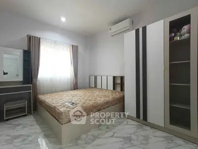 Modern minimalist bedroom with sleek furniture and marble flooring