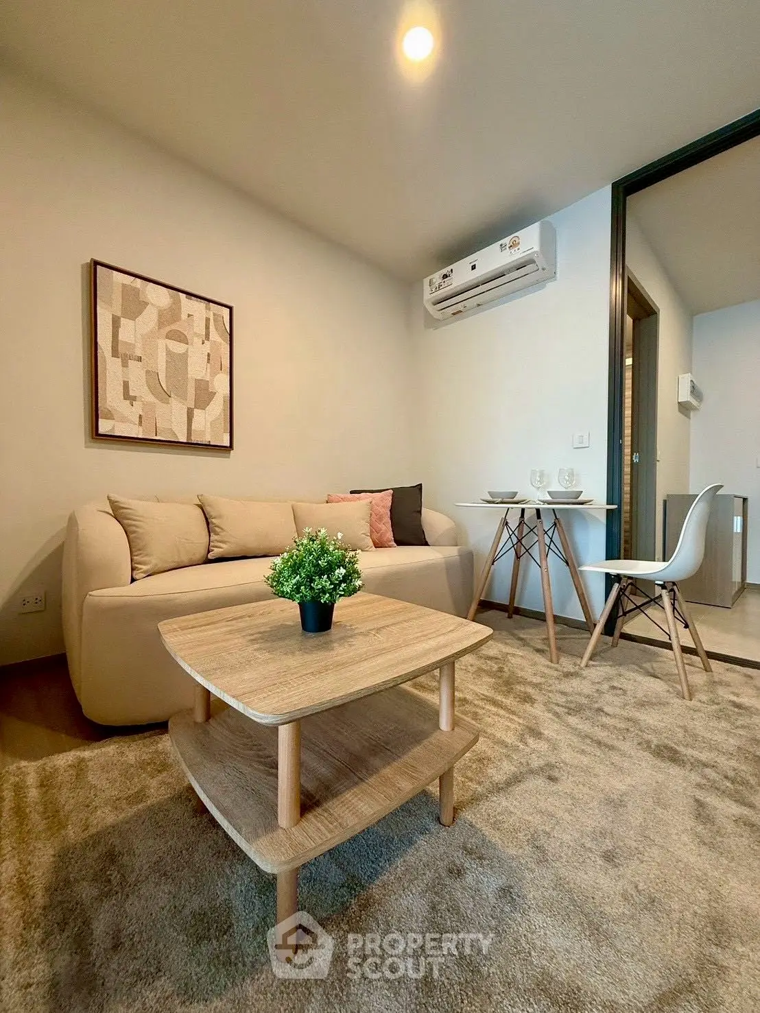 Cozy living room with modern decor and air conditioning