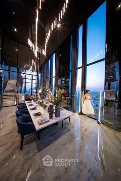 Luxurious high-rise dining area with panoramic city views and elegant decor