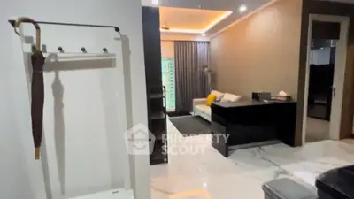 Modern living room with sleek furniture and marble flooring