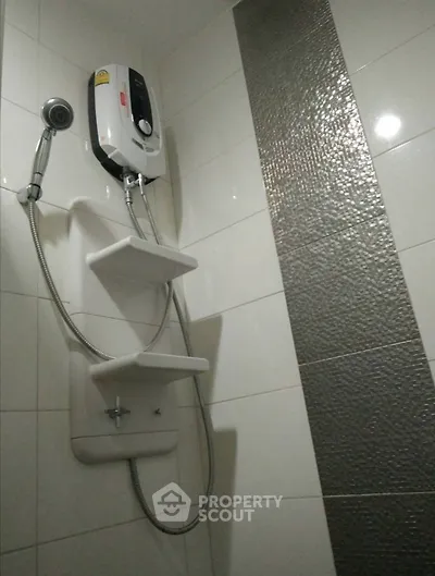 Modern bathroom with sleek shower unit and stylish tile design
