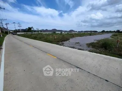 Expansive land plot with road access and scenic mountain views, ideal for development.