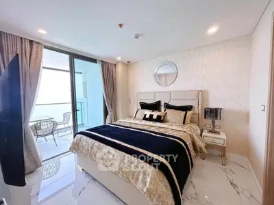 Luxurious bedroom with elegant decor and balcony access in modern apartment