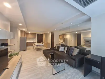 Spacious modern living room with open kitchen and stylish decor