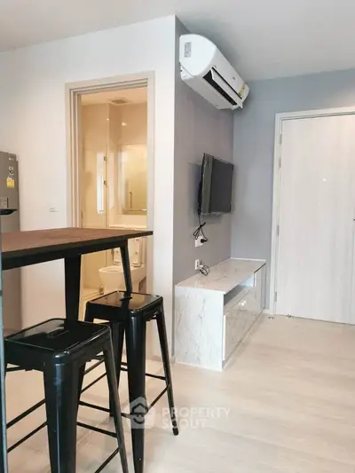 Modern apartment interior with sleek furniture and air conditioning