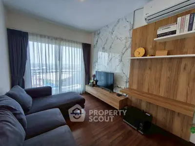 Modern living room with stylish decor and large window view