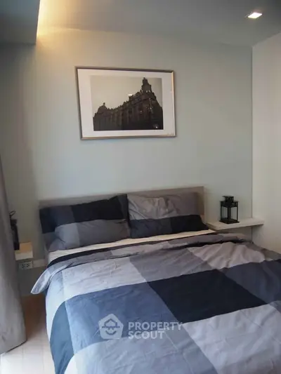 Cozy bedroom with modern decor and stylish bedding in a contemporary apartment.