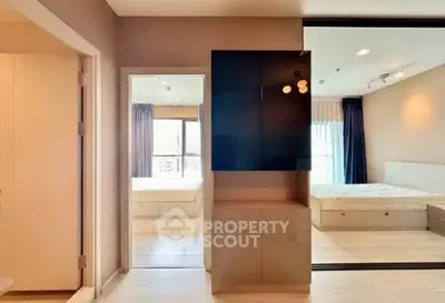 Modern bedroom with mirrored closet and natural light