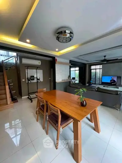 Spacious modern living room with elegant dining area and stylish decor