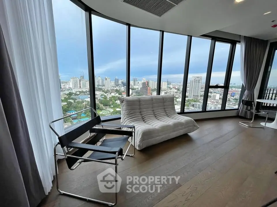 Luxurious high-rise apartment with panoramic city views and modern furnishings.