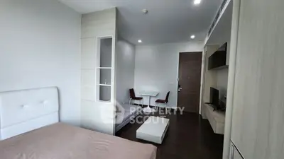 Modern studio apartment with cozy living area and stylish furnishings