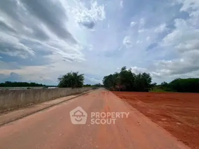 Expansive open land with clear skies, perfect for development opportunities.