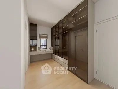 Spacious modern bedroom with sleek built-in wardrobes and large window view.